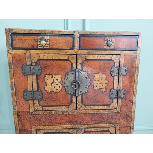 1043 - Pair of Oriental side cabinets with two drawers in the frieze above four blind doors and brass mount... 