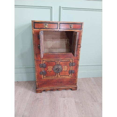 1043 - Pair of Oriental side cabinets with two drawers in the frieze above four blind doors and brass mount... 