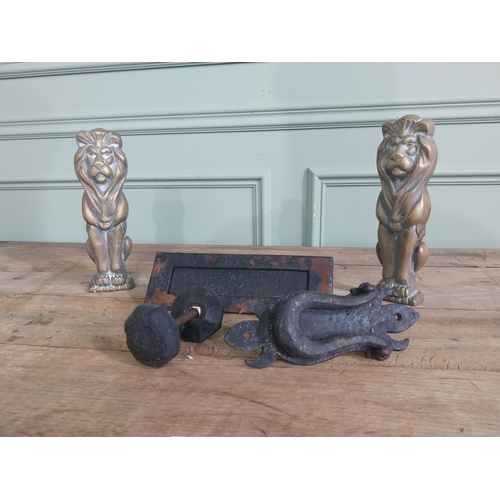 1066 - Collection of early 20th C. wrought iron door furniture and two brass fire dogs in the form of Lions... 