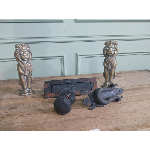 1066 - Collection of early 20th C. wrought iron door furniture and two brass fire dogs in the form of Lions... 