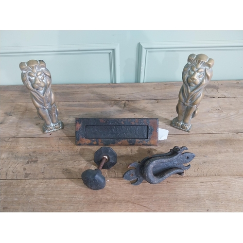 1066 - Collection of early 20th C. wrought iron door furniture and two brass fire dogs in the form of Lions... 