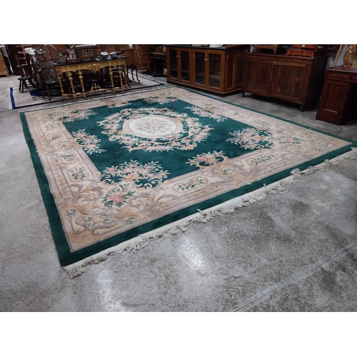 1069 - Large decorative green carpet square {487 cm L x 366 cm W}.