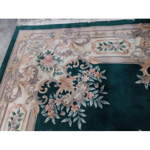 1069 - Large decorative green carpet square {487 cm L x 366 cm W}.