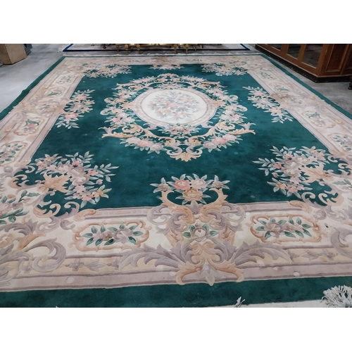 1069 - Large decorative green carpet square {487 cm L x 366 cm W}.