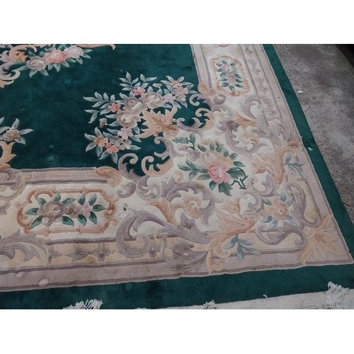 1069 - Large decorative green carpet square {487 cm L x 366 cm W}.