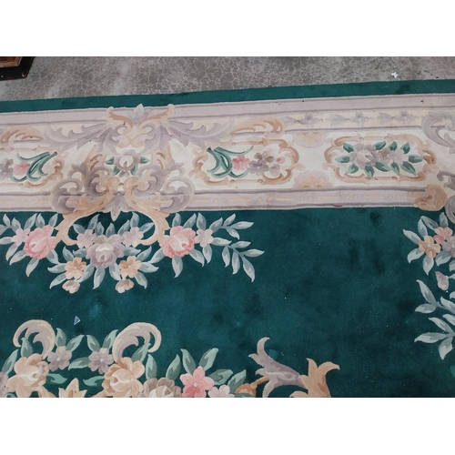 1069 - Large decorative green carpet square {487 cm L x 366 cm W}.