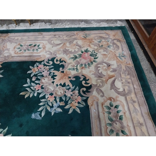 1069 - Large decorative green carpet square {487 cm L x 366 cm W}.