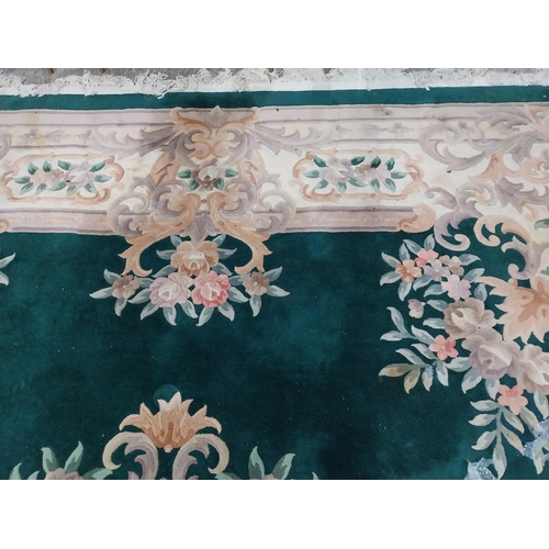 1069 - Large decorative green carpet square {487 cm L x 366 cm W}.