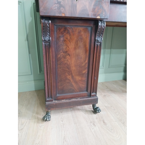 107 - Irish profusely carved mahogany sideboard with gallery decorated with central shell raised on brass ... 