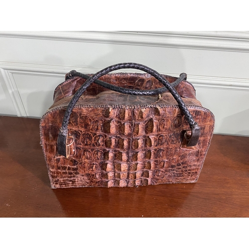 1070 - Early 20th C. crocodile leather hand bag {27 cm H x 40 cm W x 14 cm D}.