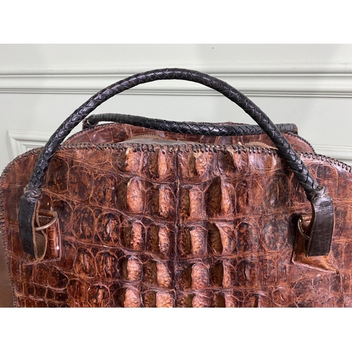 1070 - Early 20th C. crocodile leather hand bag {27 cm H x 40 cm W x 14 cm D}.