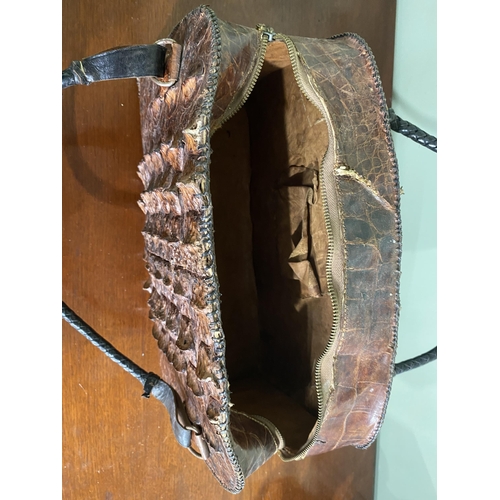 1070 - Early 20th C. crocodile leather hand bag {27 cm H x 40 cm W x 14 cm D}.