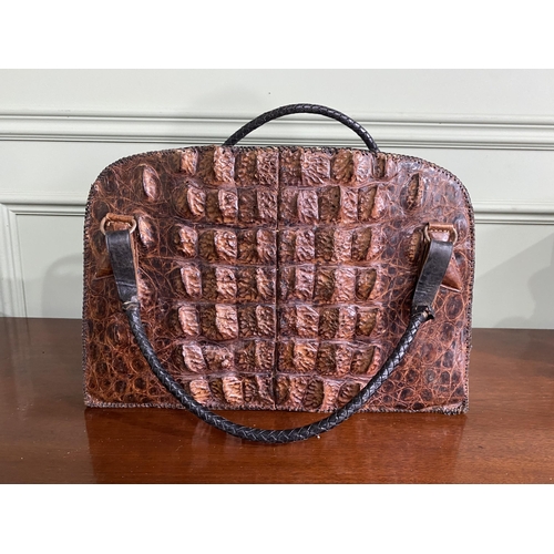 1070 - Early 20th C. crocodile leather hand bag {27 cm H x 40 cm W x 14 cm D}.