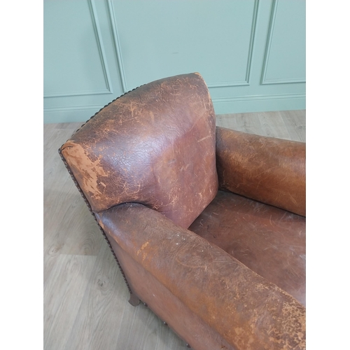 1073 - Early 20th C. French hand dyed leather upholstered club chair raised on square tapered legs {78 cm H... 