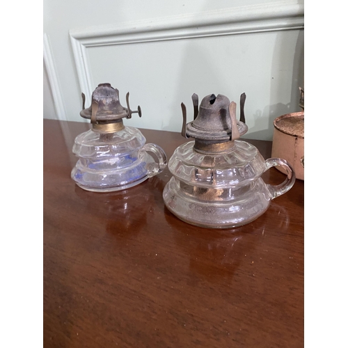 1075 - Three early 20th C. glass and metal thumb lamps and one wall mounted oil lamp {26 cm H x 14 cm W x 1... 