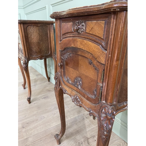 1078 - Pair of 19th C. French carved walnut bedside lockers with inset marble tops and one single drawer ov... 