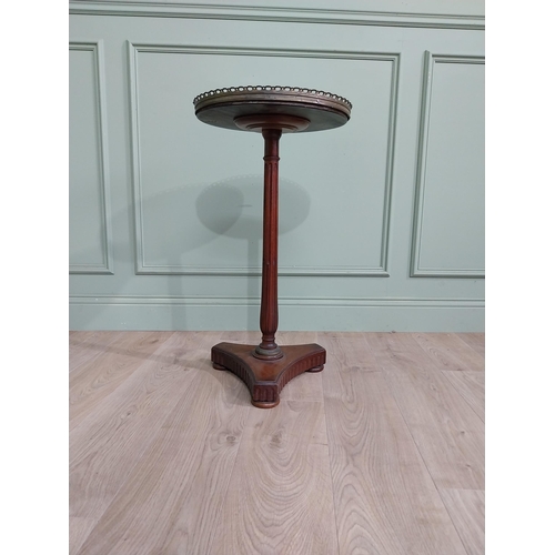 108 - 19th C. mahogany wine table with marble top and brass gallery raised on reeded column and platform b... 