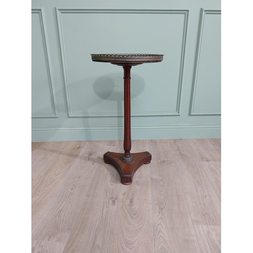 108 - 19th C. mahogany wine table with marble top and brass gallery raised on reeded column and platform b... 