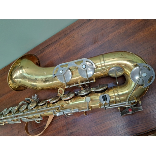 1088 - Saxophone in case  {H 85cm x W 15cm x D 25cm }. - NOT AVAILABLE TO VIEW IN PERSON