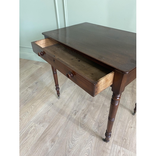 1095 - Georgian mahogany side table with single drawer in the frieze raised on turned legs and brass castor... 