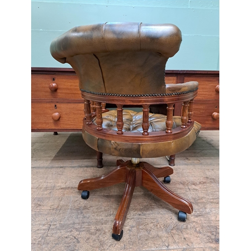 1098 - Deep buttoned leather captains swivel chair  {H 88cm x W 62cm }. - NOT AVAILABLE TO VIEW IN PERSON