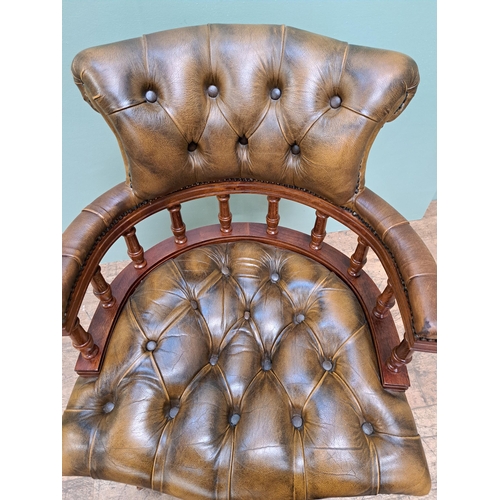 1098 - Deep buttoned leather captains swivel chair  {H 88cm x W 62cm }. - NOT AVAILABLE TO VIEW IN PERSON