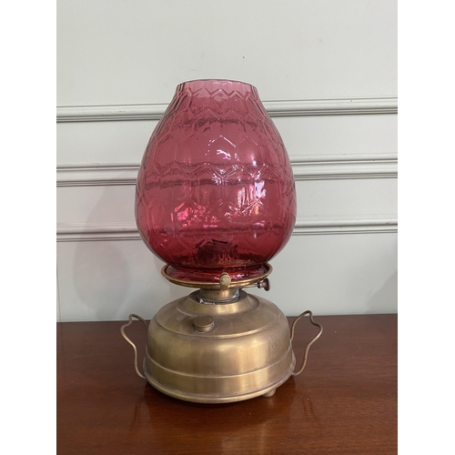 1099 - Early 20th C. brass Veritas oil lamp with ruby glass shade {42 cm H x 28 cm Dia.}.