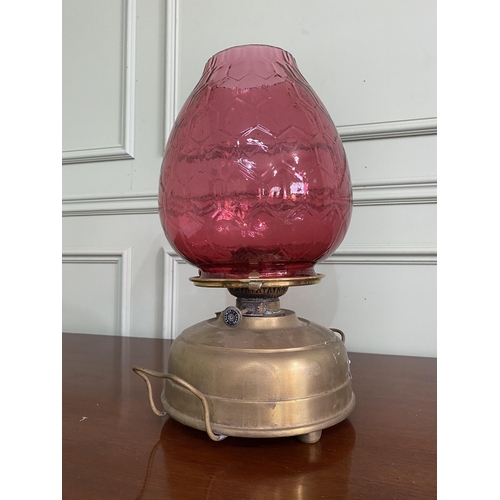 1099 - Early 20th C. brass Veritas oil lamp with ruby glass shade {42 cm H x 28 cm Dia.}.