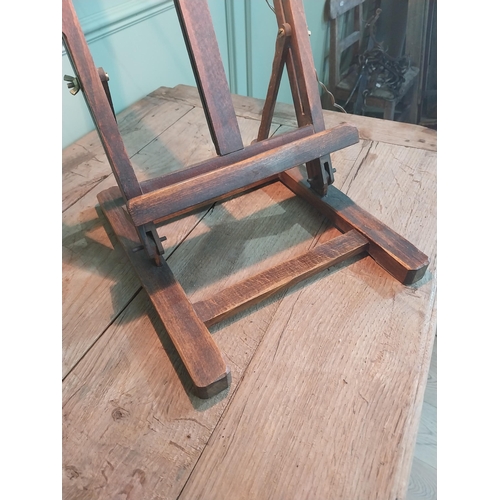 1102 - 1950s oak easel with light {78 cm H x 30 cm W x 37 cm D}.