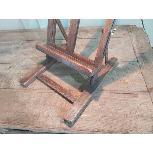 1102 - 1950s oak easel with light {78 cm H x 30 cm W x 37 cm D}.