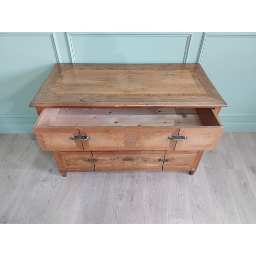 1104 - 19th C. French walnut chest of drawers with three long drawers and brass handles raised on square ta... 