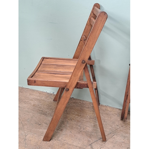 1134 - Set of four teak folding chairs  {H 78cm x W 46cm x D 41cm }. - NOT AVAILABLE TO VIEW IN PERSON