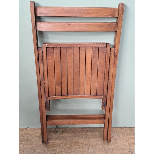 1134 - Set of four teak folding chairs  {H 78cm x W 46cm x D 41cm }. - NOT AVAILABLE TO VIEW IN PERSON