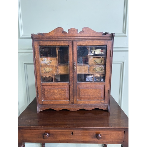 1136 - Good quality Edwardian oak smokers cabinet with two glazed doors and fitted interior {62 cm H x 54 c... 