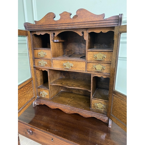 1136 - Good quality Edwardian oak smokers cabinet with two glazed doors and fitted interior {62 cm H x 54 c... 