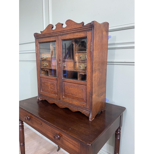 1136 - Good quality Edwardian oak smokers cabinet with two glazed doors and fitted interior {62 cm H x 54 c... 