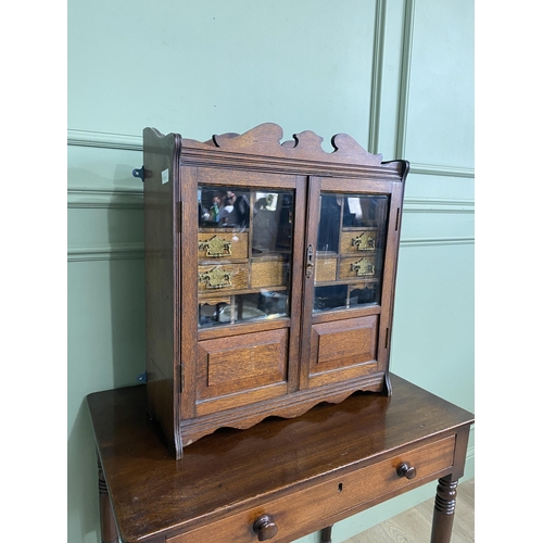 1136 - Good quality Edwardian oak smokers cabinet with two glazed doors and fitted interior {62 cm H x 54 c... 