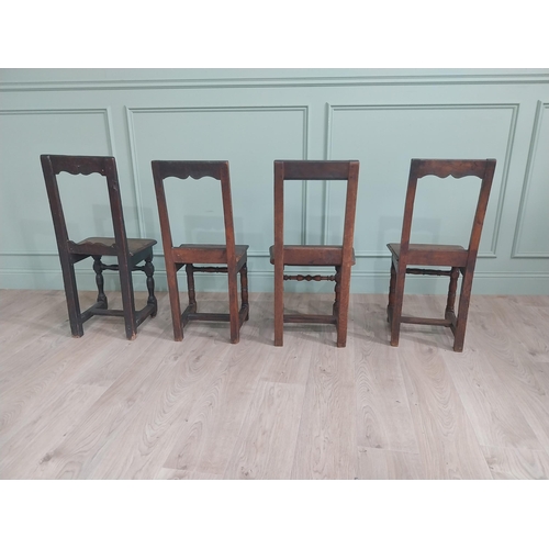 1138 - Harlequin set of four 19th C. French oak chairs {83 cm H x 42 cm W x 36 cm D}.