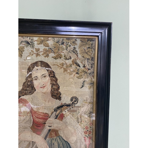 117 - 19th C. maiden tapestry mounted in ebonised frame {47 cm H x 39 cm W}.