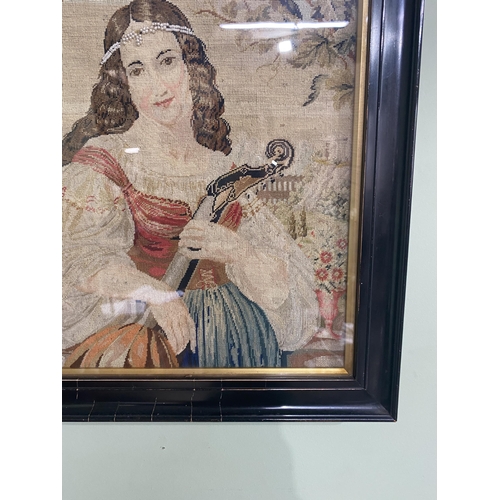 117 - 19th C. maiden tapestry mounted in ebonised frame {47 cm H x 39 cm W}.