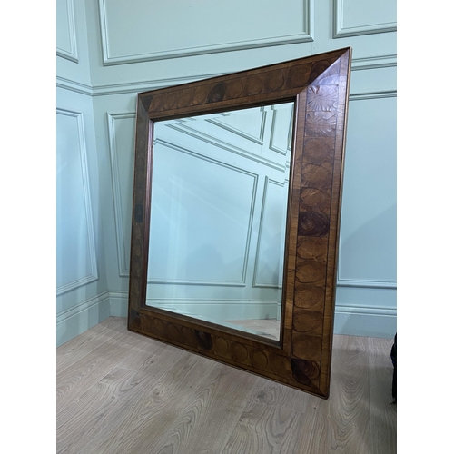 12 - Good quality oyster veneered cushion wall mirror {117 cm H x 100 cm W}.