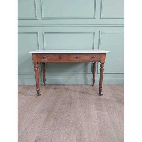 1200 - 19th C. mahogany Gillow & Co. side table with marble top and two drawers in the frieze raised on tur... 