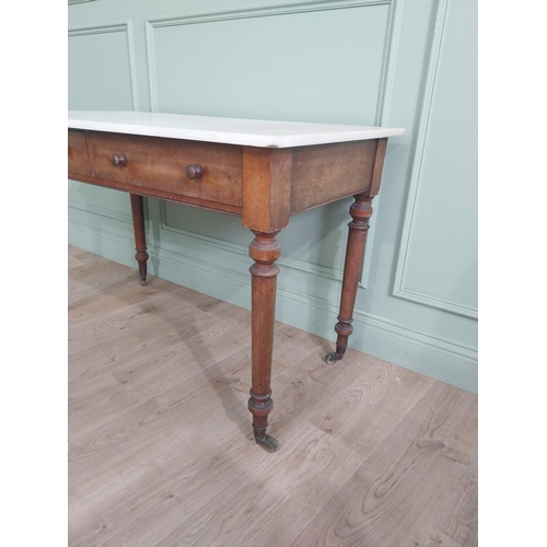 1200 - 19th C. mahogany Gillow & Co. side table with marble top and two drawers in the frieze raised on tur... 