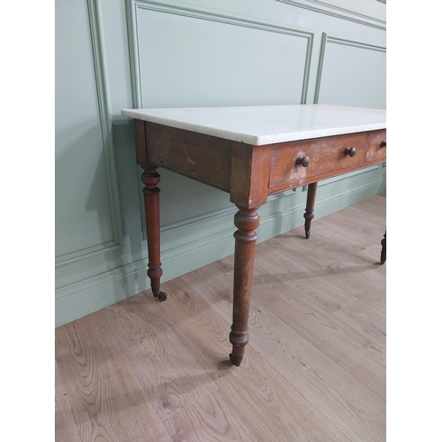 1200 - 19th C. mahogany Gillow & Co. side table with marble top and two drawers in the frieze raised on tur... 