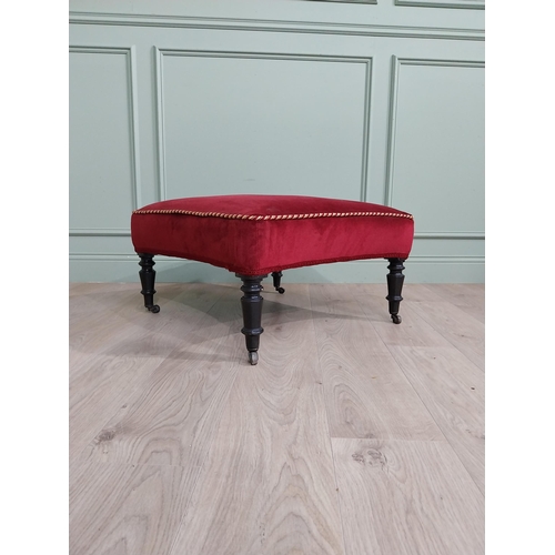 1213 - 19th C. French upholstered footstool raised on ebonised turned legs and brass castors {37 cm H x 68 ... 