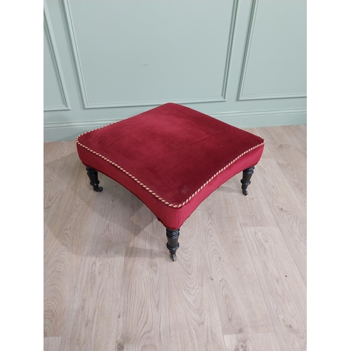 1213 - 19th C. French upholstered footstool raised on ebonised turned legs and brass castors {37 cm H x 68 ... 