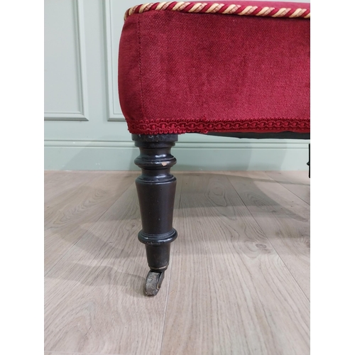 1213 - 19th C. French upholstered footstool raised on ebonised turned legs and brass castors {37 cm H x 68 ... 