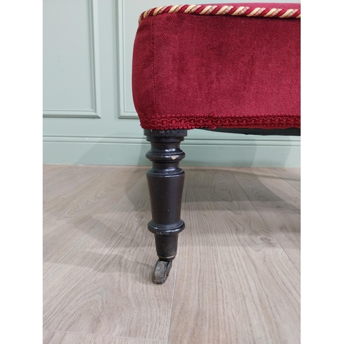 1213 - 19th C. French upholstered footstool raised on ebonised turned legs and brass castors {37 cm H x 68 ... 