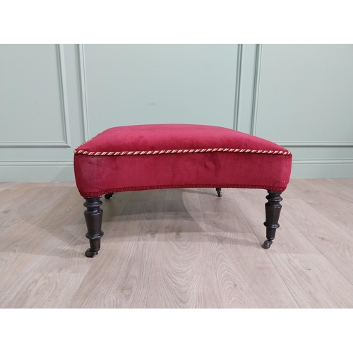 1213 - 19th C. French upholstered footstool raised on ebonised turned legs and brass castors {37 cm H x 68 ... 