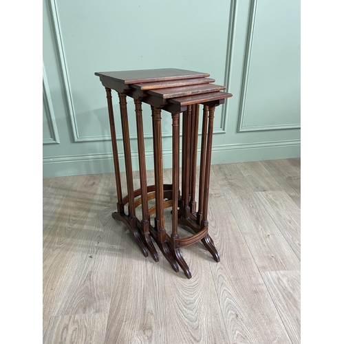 1216 - Edwardian mahogany nest of four tables raised on reeded legs {70 cm H x 35 cm W  x 26 cm D}.